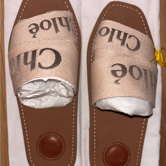Chloe Shoes - Chloe Beige Canvas Logo Slide Sandals
(Comes with box and dust bag)